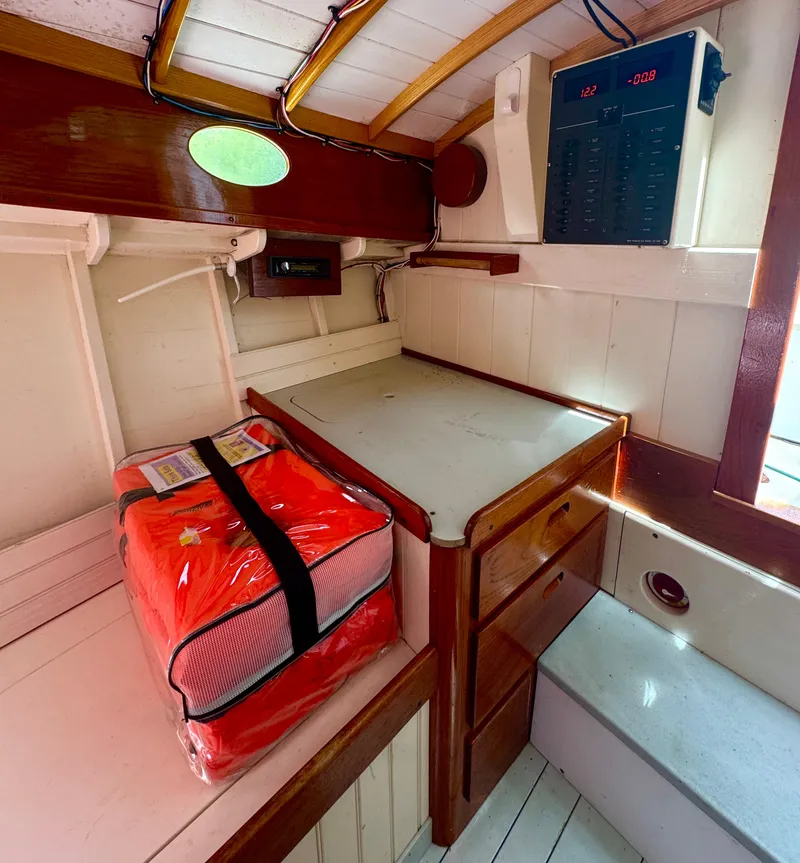 Slide: The Image of Interior of 2008 Custom Eldred Cooper 30 Downeast boat with storage and safety equipment. - 14