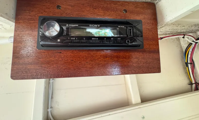 Slide: The Image of Sony stereo system installed on a wooden panel in a 2008 Custom Eldred Cooper 30 Downeast boat. - 18