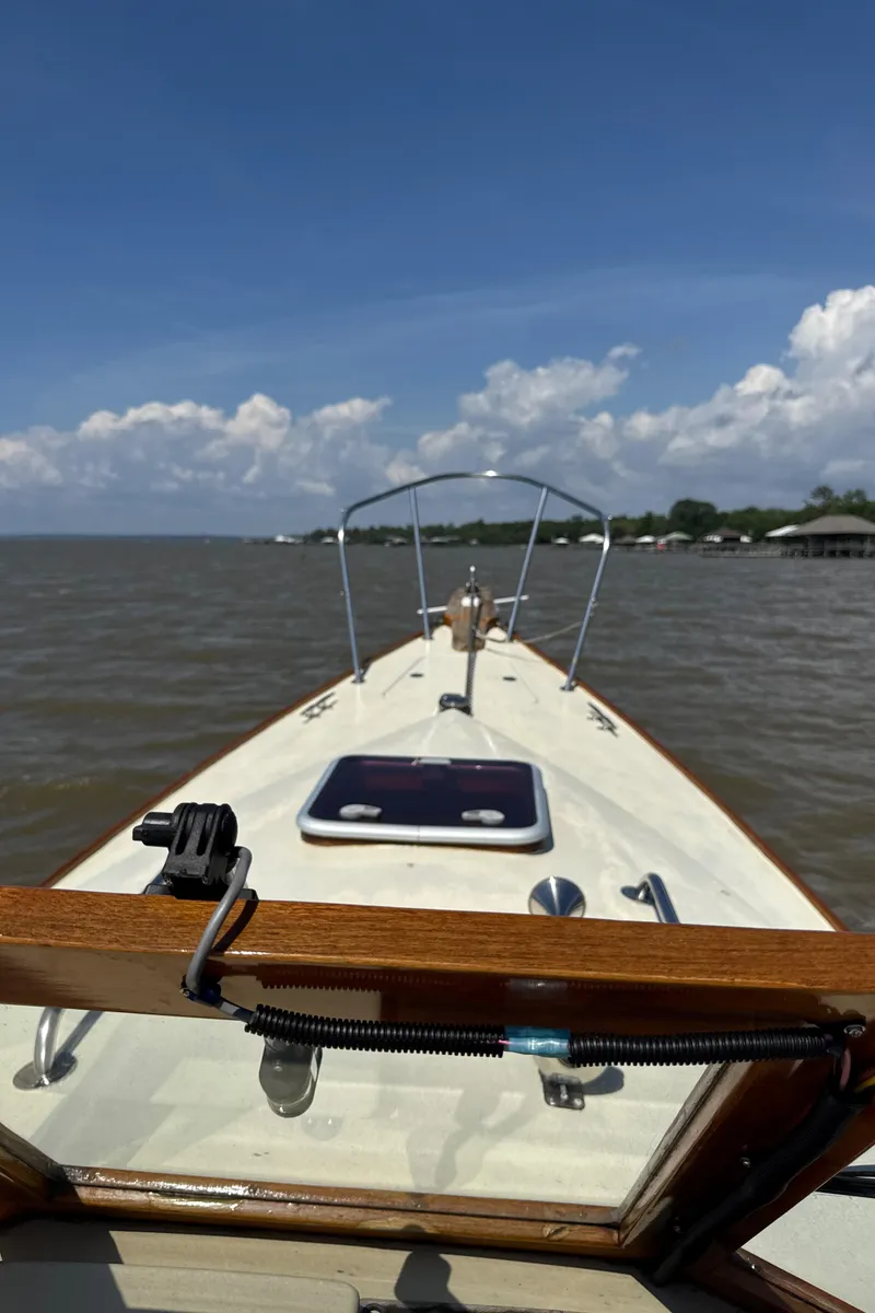 Slide: The Image of Bow view of 2008 Custom Eldred Cooper 30 Downeast boat on calm water under blue sky. - 21