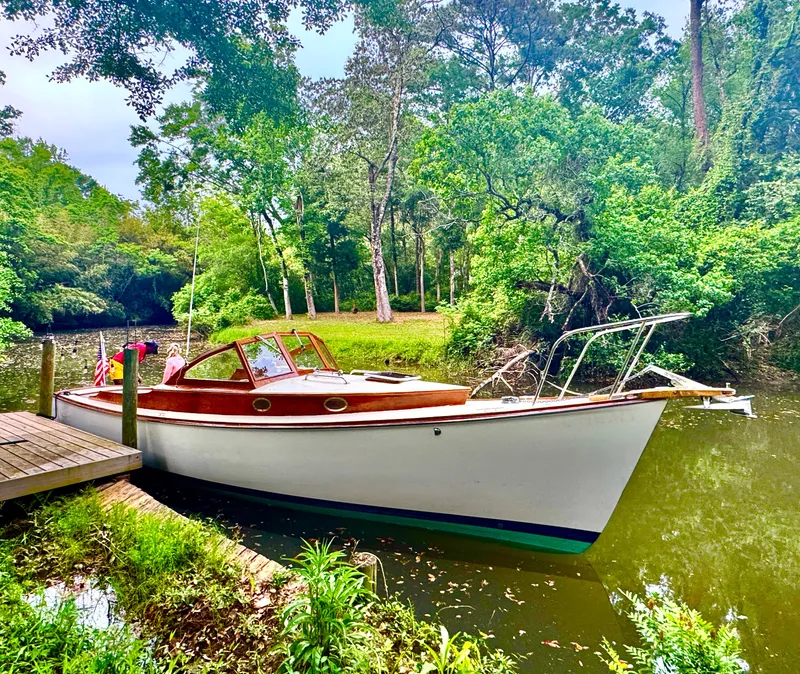 Slide: The Image of Custom Eldred Cooper 30 Downeast boat, 2008 model, docked in a lush, green riverside setting. - 8