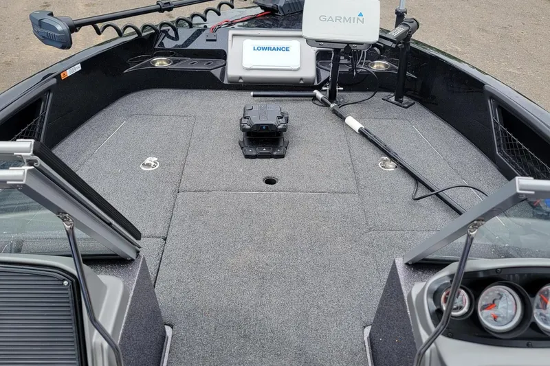 Slide: The Image of 2025 Ranger 2080 Angler boat interior with Garmin and Lowrance electronics. - 11