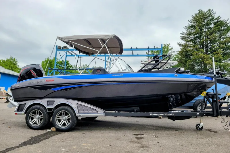 Slide: The Image of 2025 Ranger 2080 Angler boat on trailer, featuring sleek design and modern features. - 19
