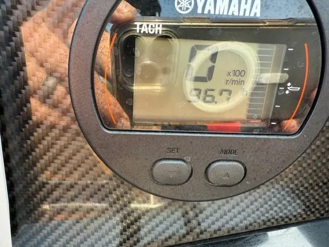 Slide: The Image of Yamaha tachometer on 2021 Glastron GTD 240 boat dashboard, carbon fiber finish. - 10