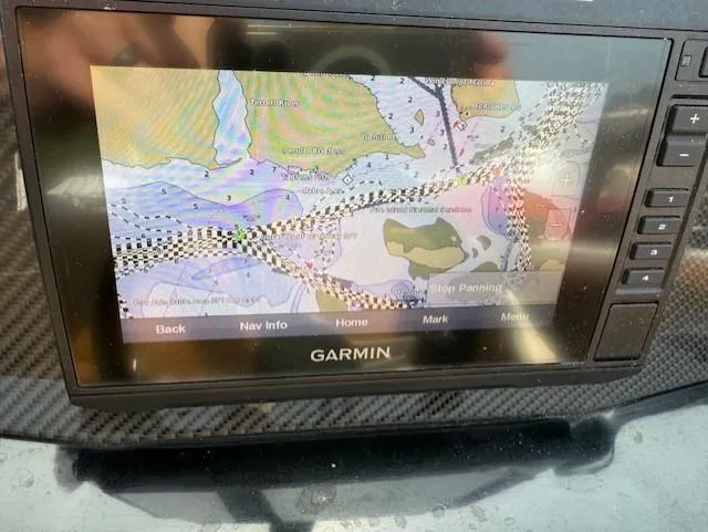 Slide: The Image of Garmin navigation system on 2021 Glastron GTD 240 boat dashboard. - 11