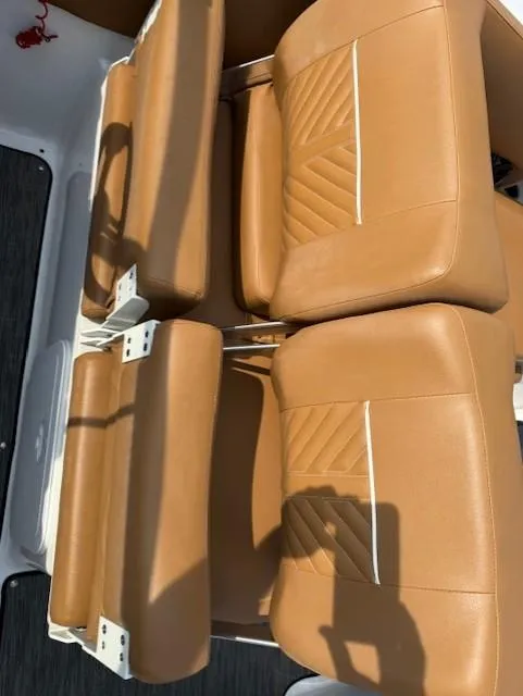 Slide: The Image of 2021 Glastron GTD 240 boat seats with tan upholstery and white accents. - 14