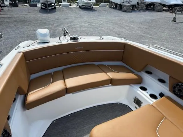 Slide: The Image of 2021 Glastron GTD 240 boat interior with tan seating and cup holders. - 15