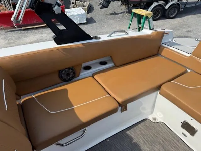 Slide: The Image of 2021 Glastron GTD 240 boat interior with tan seating and cup holders. - 16