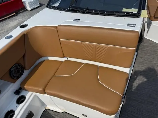 Slide: The Image of 2021 Glastron GTD 240 boat interior with tan leather seating and cup holders. - 17