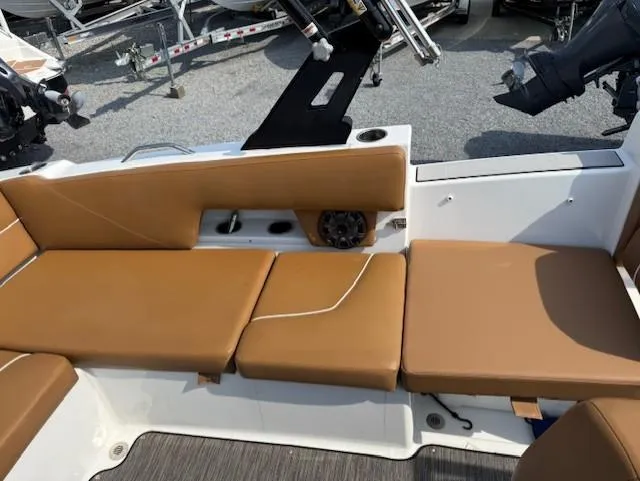 Slide: The Image of 2021 Glastron GTD 240 boat interior with tan seating and speaker. - 19