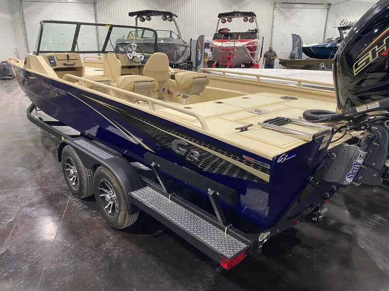 Slide: The Image of 2025 G3 Sportsman 2400 boat in showroom, featuring dual axles and sleek design. - 3