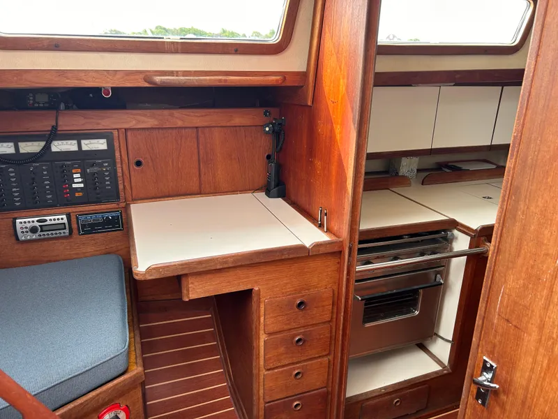 Slide: The Image of Interior of 1983 Sabre 38 sailboat with wood cabinetry and navigation equipment. - 17