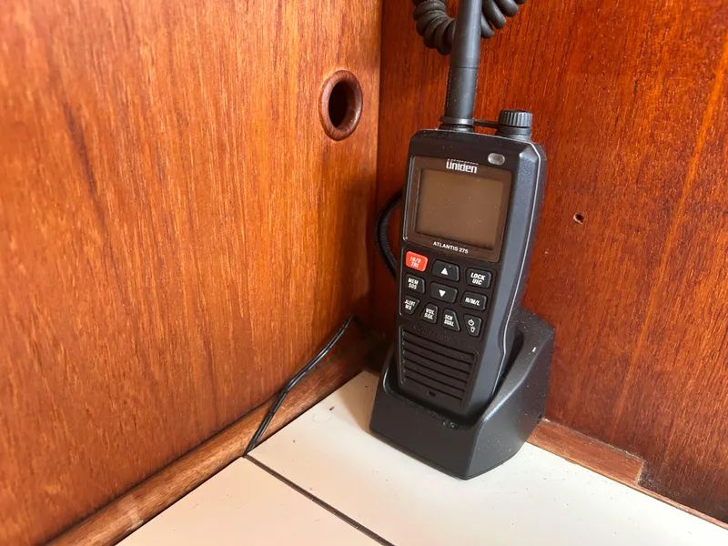 Slide: The Image of Handheld radio in a wooden cabin of a 1983 Sabre 38 sailboat. - 18