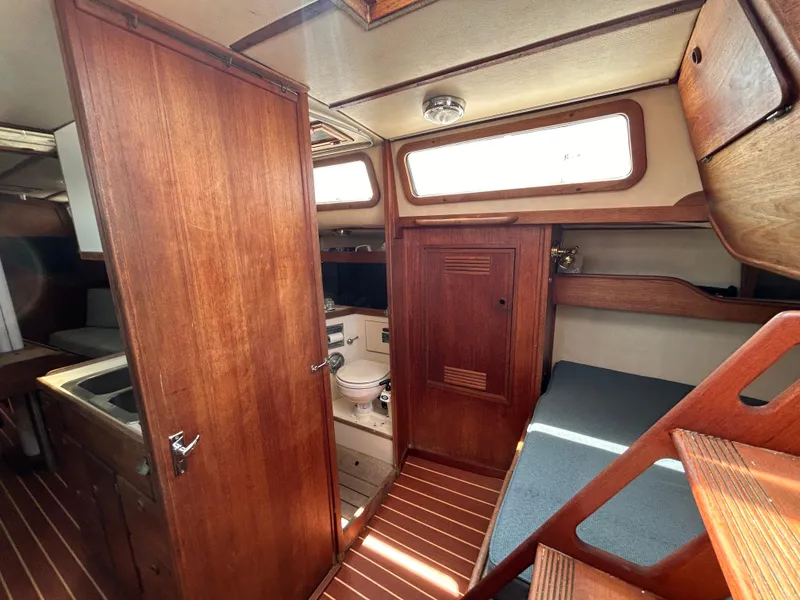 Slide: The Image of Interior of 1983 Sabre 38 sailboat with wooden cabinetry and compact bathroom. - 25