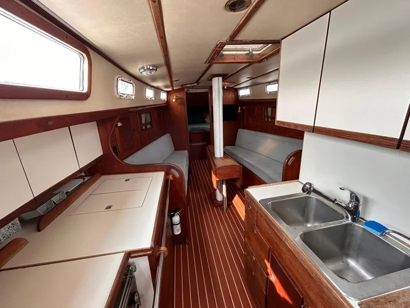 Slide: The Image of Interior of 1983 Sabre 38 sailboat with wood finishes and dual sinks. - 9