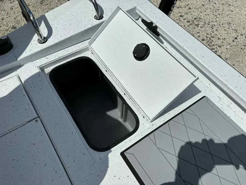 Slide: The Image of Open storage compartment on 2026 Xpress H190B boat deck. - 10