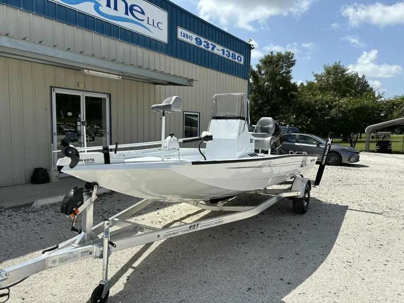 Slide: The Image of 2026 Xpress H190B boat on trailer outside a dealership under a clear sky. - 4