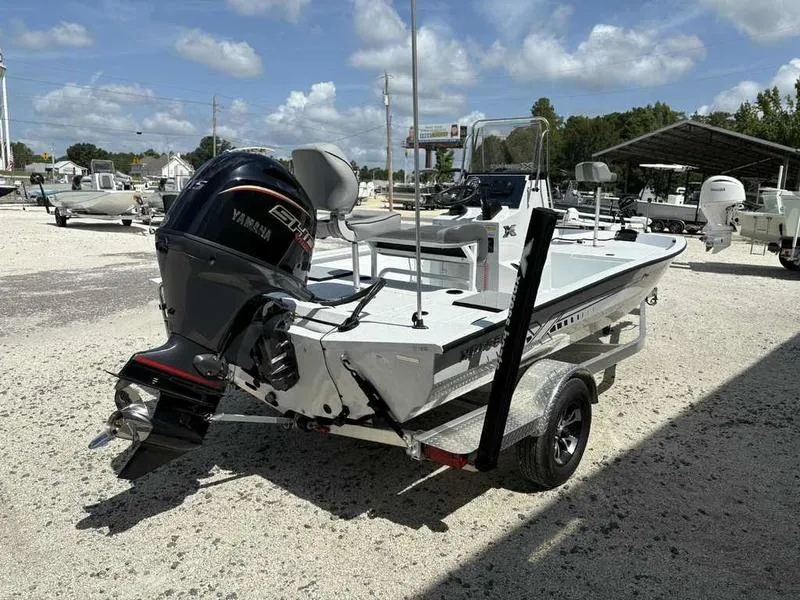 Slide: The Image of 2026 Xpress H190B boat with Yamaha engine on trailer, parked outdoors under a sunny sky. - 5