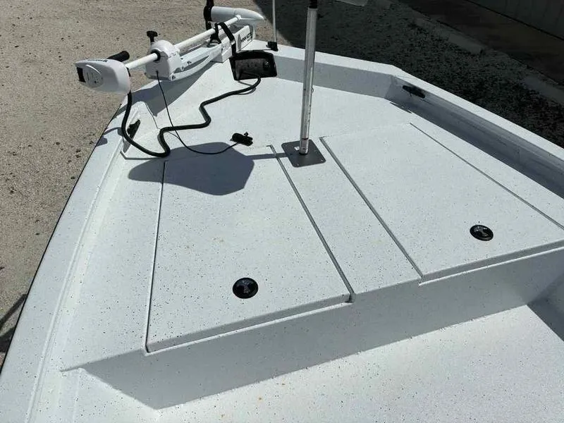 Slide: The Image of 2026 Xpress H190B boat deck with mounted trolling motor and storage compartments. - 8