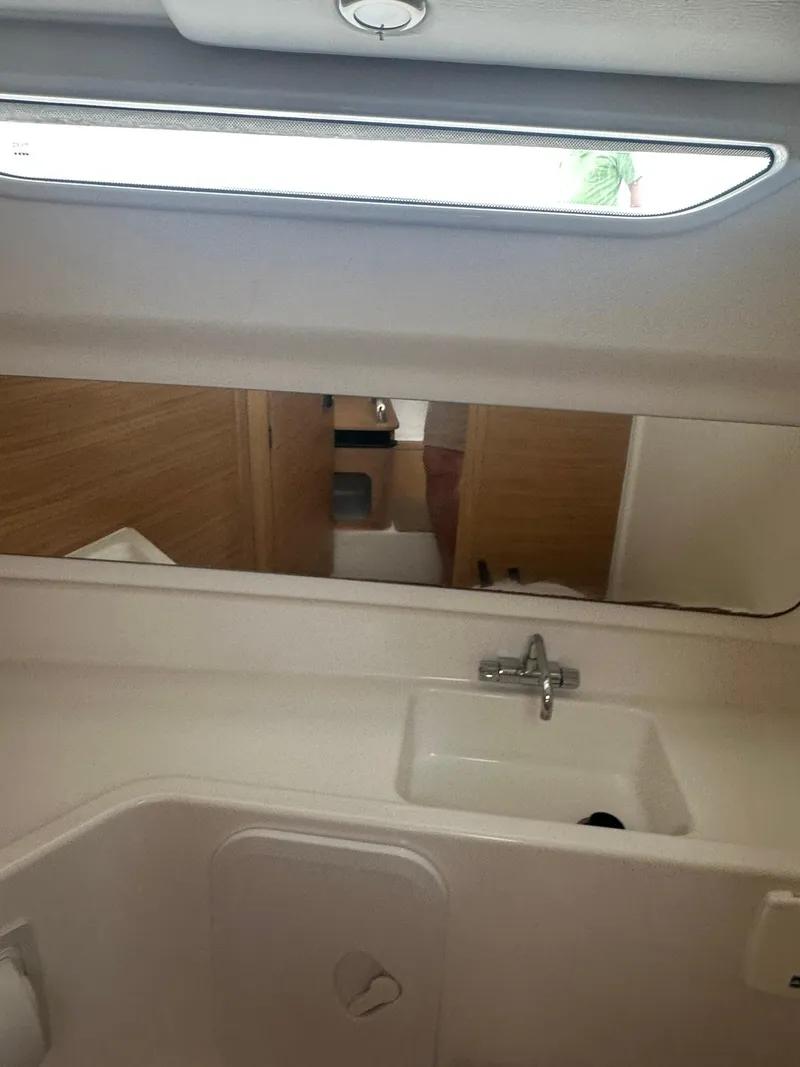 Slide: The Image of 2023 Nimbus Commuter 9 interior bathroom with sink and mirror. - 19