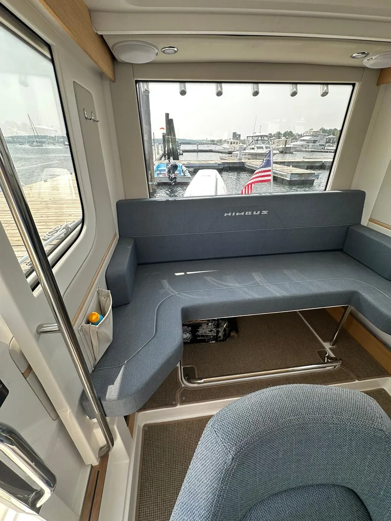 Slide: The Image of Interior of 2023 Nimbus Commuter 9 boat with seating and harbor view. - 21