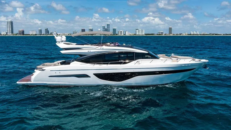 Slide: The Image of Luxury 2021 Princess S78 yacht cruising on blue ocean near city skyline. - 11