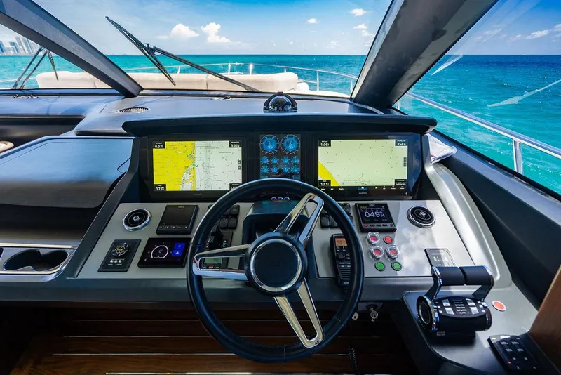 Slide: The Image of Helm of 2021 Princess S78 yacht with navigation screens and ocean view. - 36