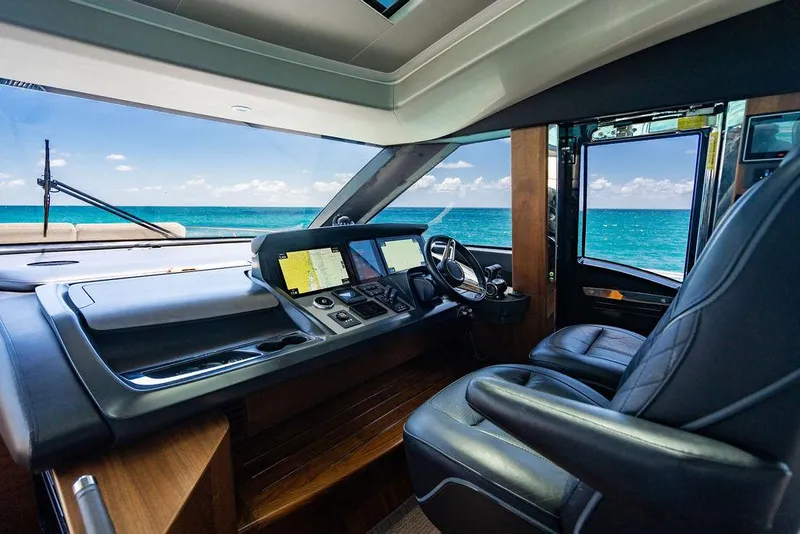 Slide: The Image of Luxurious 2021 Princess S78 yacht cockpit with ocean view, featuring modern navigation equipment. - 37