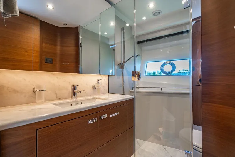 Slide: The Image of Luxurious bathroom in 2021 Princess S78 yacht with modern fixtures and elegant wood finishes. - 45