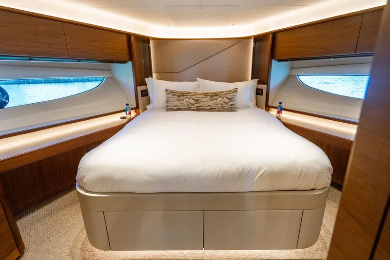 Slide: The Image of Luxurious bedroom interior of 2021 Princess S78 yacht with elegant wood finishes. - 46