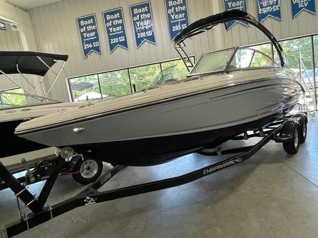 Slide: The Image of 2026 Chaparral 23 SSi boat interior with gray seating and modern dashboard design. - 3