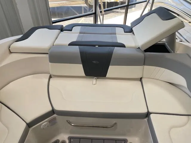 Slide: The Image of 2026 Chaparral 23 SSi boat interior with gray cushioned seating and sleek design. - 7