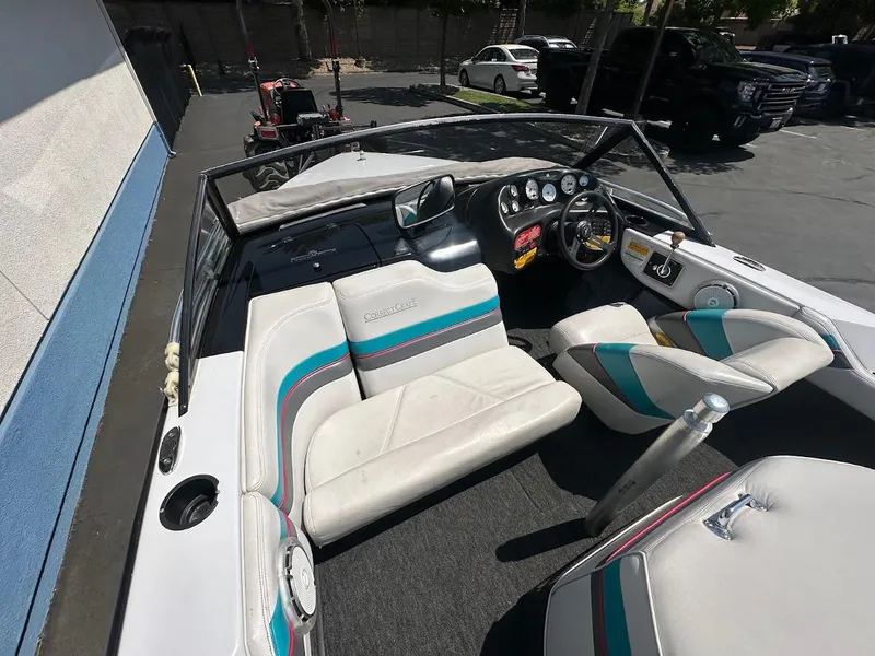 Slide: The Image of 1992 Correct Craft Ski Nautique interior with white seats and colorful accents. - 10