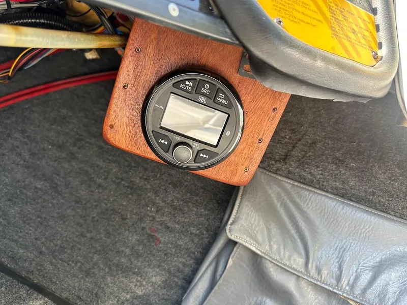 Slide: The Image of 1992 Correct Craft Ski Nautique dashboard with control panel and wiring. - 16