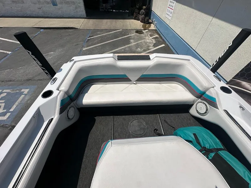 Slide: The Image of 1992 Correct Craft Ski Nautique boat interior with white and teal seating. - 20