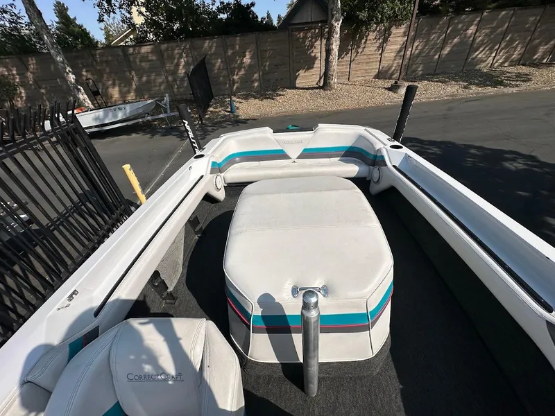 Slide: The Image of 1992 Correct Craft Ski Nautique boat interior with white and teal upholstery. - 21
