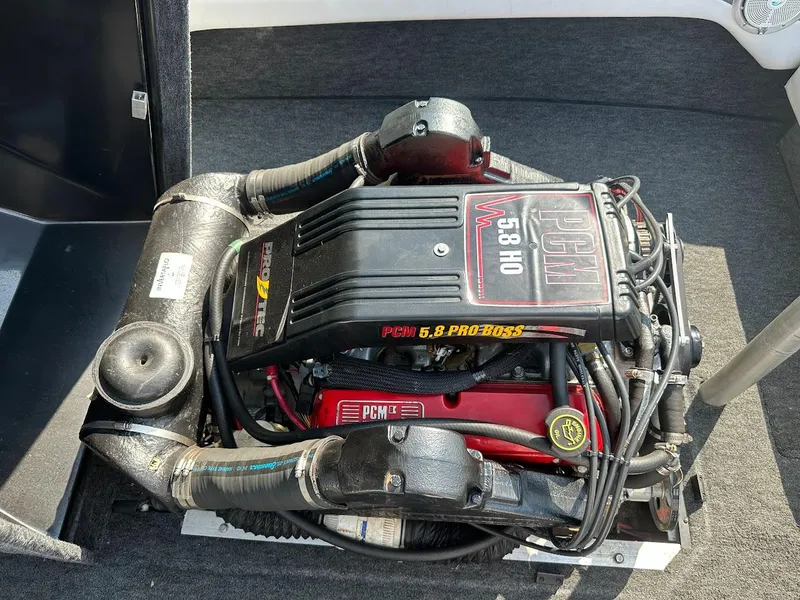 Slide: The Image of 1992 Correct Craft Ski Nautique PCM 5.8 HO engine in a boat interior. - 24