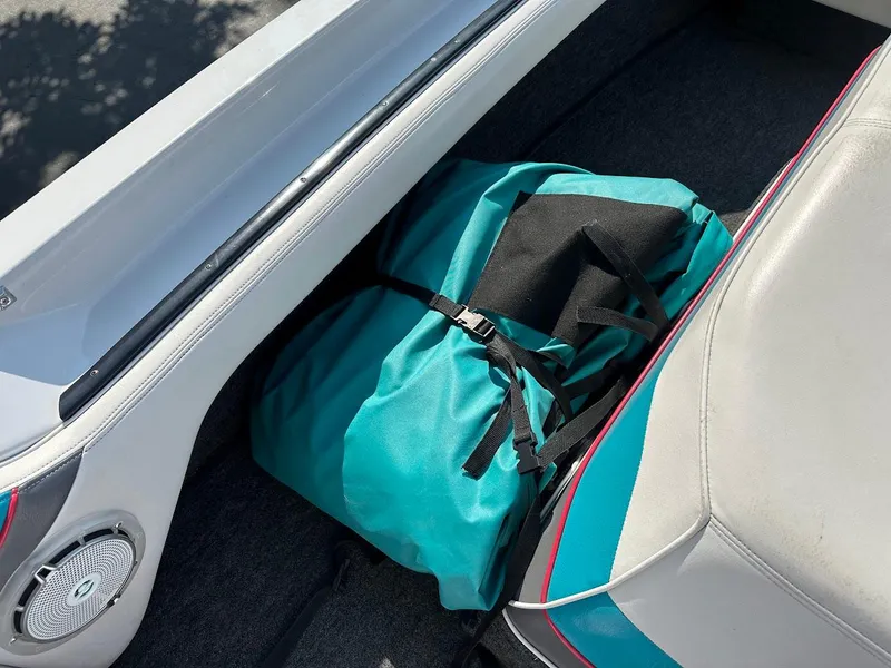 Slide: The Image of 1992 Correct Craft Ski Nautique interior with teal bag and speaker. - 25