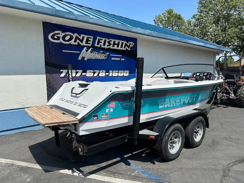 Slide: The Image of 1992 Correct Craft Ski Nautique boat on trailer, parked outside Gone Fishin' Marine. - 5