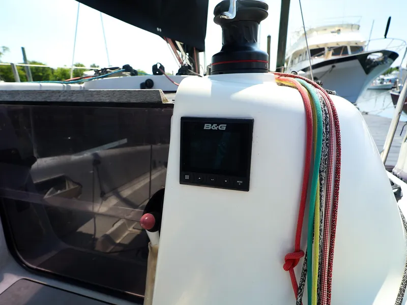 Slide: The Image of 2021 Beneteau First 27 SE sailboat cockpit with B&G navigation system and colorful ropes. - 12