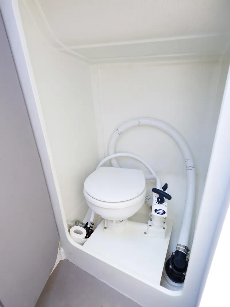 Slide: The Image of Compact marine toilet in 2021 Beneteau First 27 SE sailboat bathroom. - 31