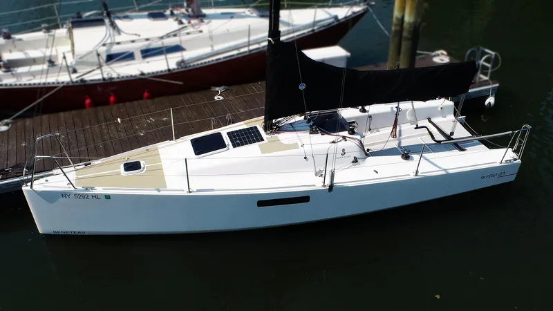 Slide: The Image of 2021 Beneteau First 27 SE sailboat docked, featuring sleek design and modern amenities. - 4