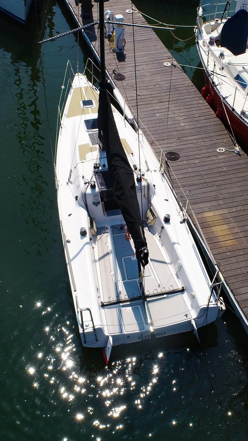 Slide: The Image of 2021 Beneteau First 27 SE sailboat docked in marina, aerial view. - 5