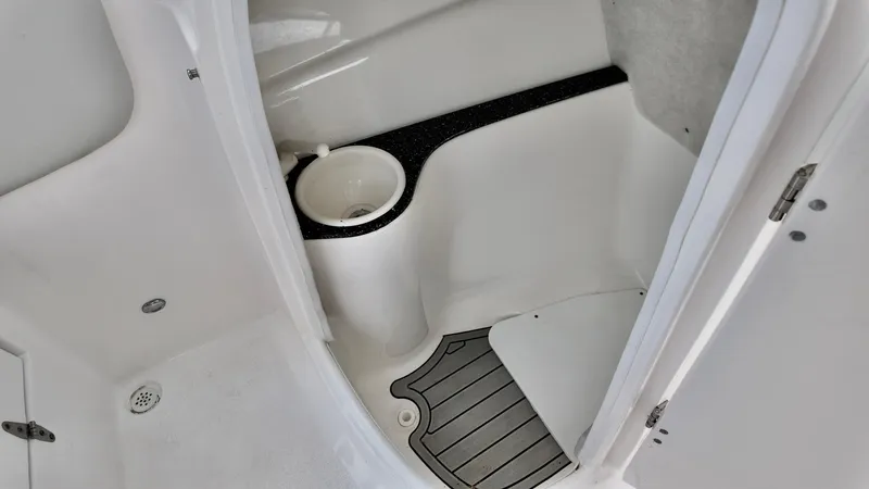Slide: The Image of 2023 Sea Fox 226 Traveler boat interior with storage compartment and non-slip flooring. - 14