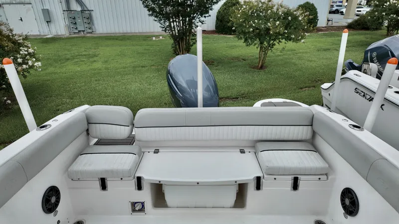 Slide: The Image of 2023 Sea Fox 226 Traveler boat interior with cushioned seating and storage. - 16