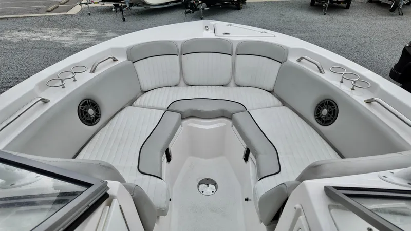 Slide: The Image of 2023 Sea Fox 226 Traveler boat interior with cushioned seating and cup holders. - 17