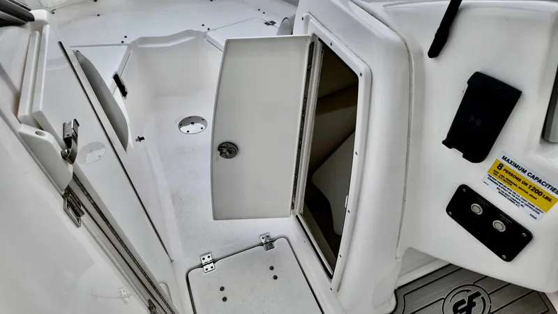 Slide: The Image of 2023 Sea Fox 226 Traveler boat interior with open storage compartment. - 18