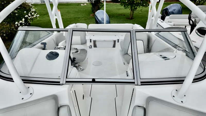Slide: The Image of 2023 Sea Fox 226 Traveler boat interior with white seating and windshield. - 19