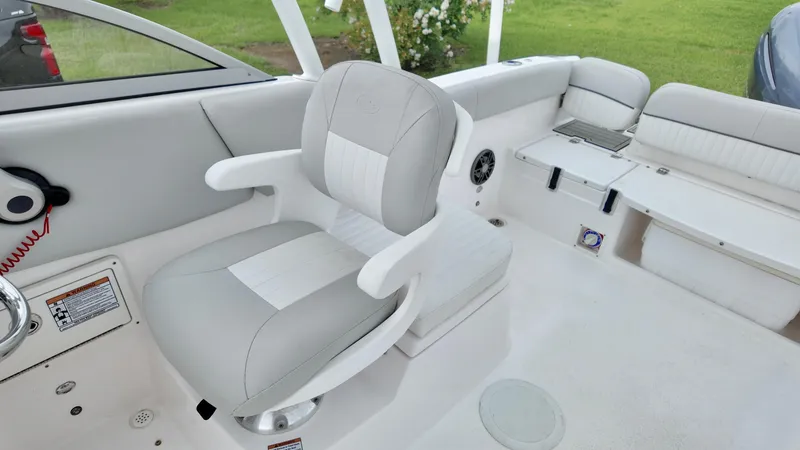 Slide: The Image of 2023 Sea Fox 226 Traveler boat interior with cushioned seating and modern design. - 24