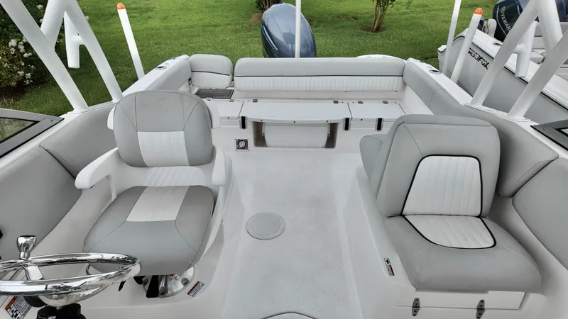 Slide: The Image of 2023 Sea Fox 226 Traveler boat interior with gray and white seating. - 26