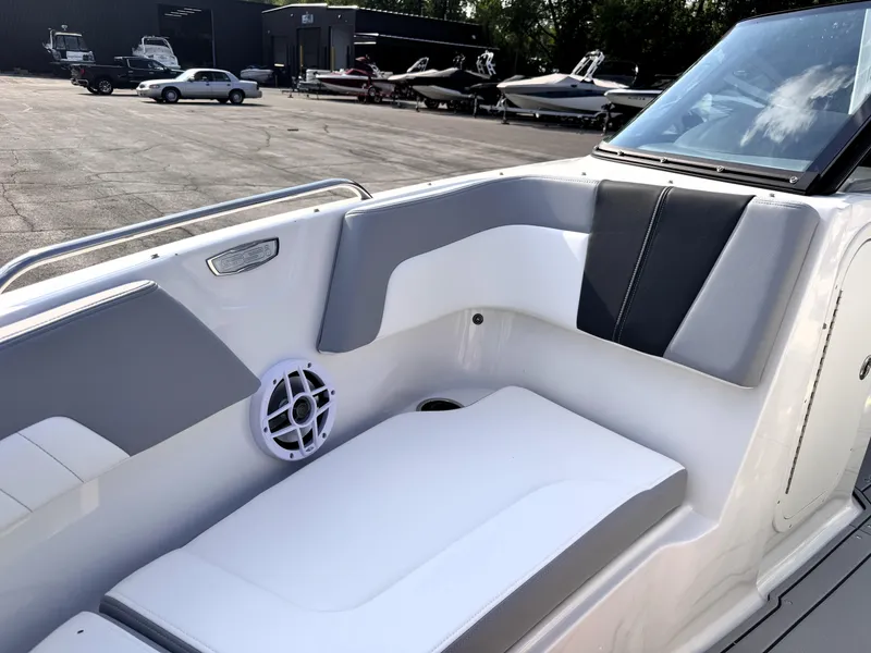 Slide: The Image of 2025 Chaparral 23 SSi boat interior with sleek seating and speaker system. - 11